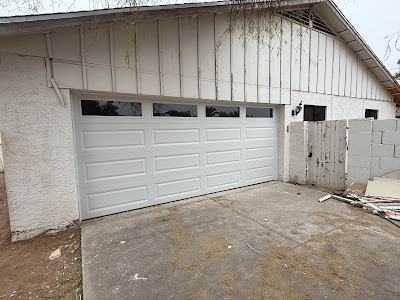 When to Call a Professional for Garage Door Spring Repair